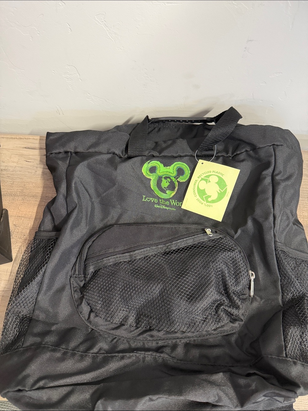Disney Black Backpack with Green 'Love the World' Tag